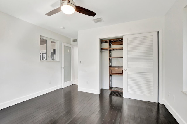 unfurnished bedroom featuring a closet, ceiling fan, and dark hardwood / wood-style floors