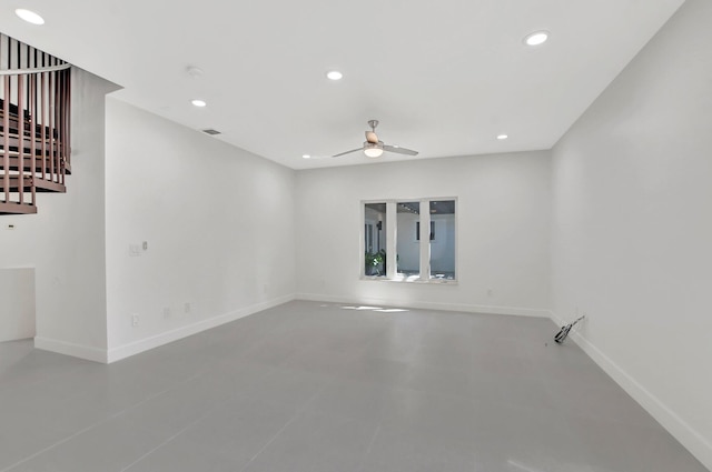 unfurnished room featuring concrete flooring and ceiling fan