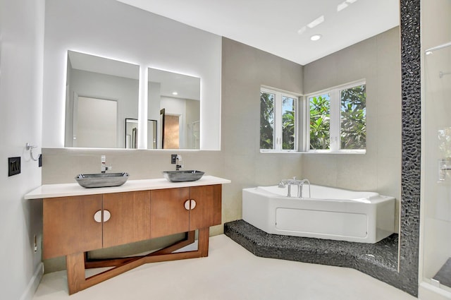 bathroom with vanity and a bathing tub