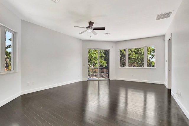 spare room with ceiling fan and dark hardwood / wood-style floors