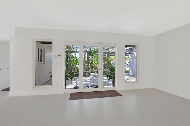 spare room with concrete flooring