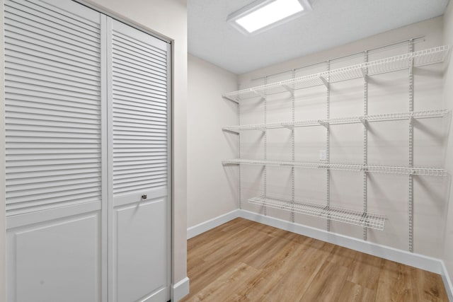 walk in closet featuring light wood-type flooring