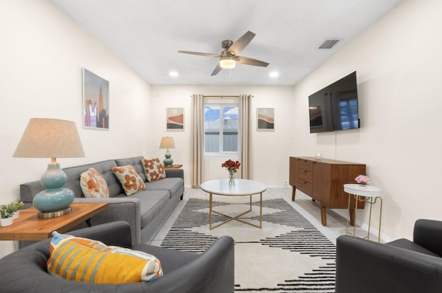 living room featuring tile patterned flooring and ceiling fan