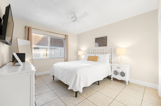 tiled bedroom featuring ceiling fan