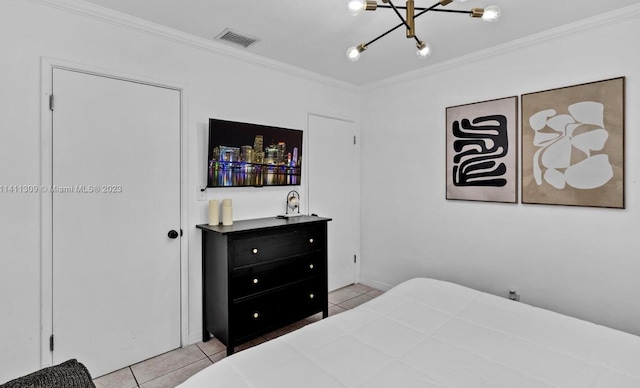 bedroom with light tile patterned floors and ornamental molding