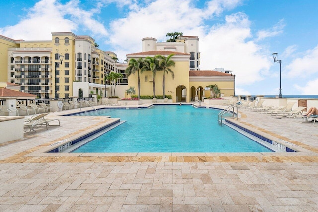 view of swimming pool with a patio area