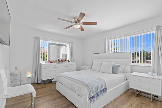 bedroom featuring ceiling fan and hardwood / wood-style flooring