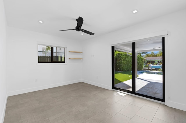 unfurnished room with ceiling fan