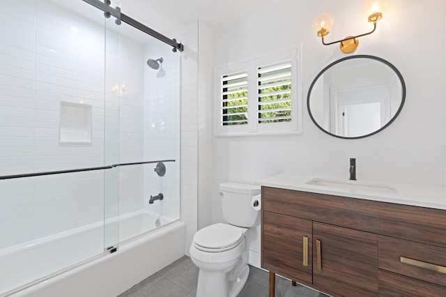 full bathroom featuring enclosed tub / shower combo, vanity, toilet, and tile patterned floors