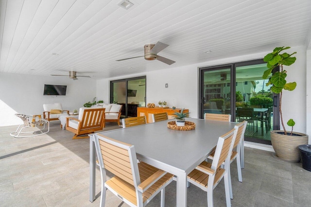 interior space with an outdoor hangout area and ceiling fan