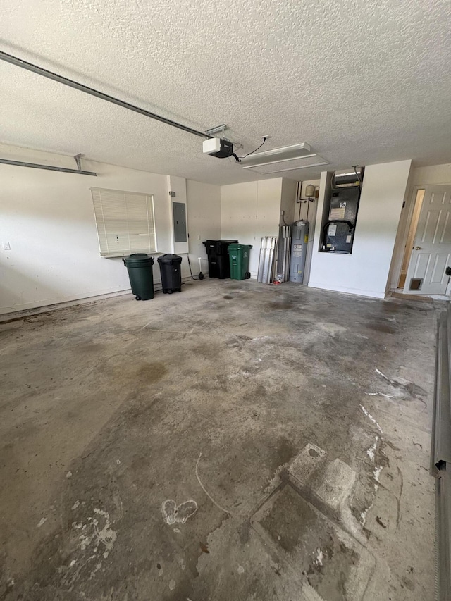 565 SW New Castle Cv, Port Saint Lucie, FL 34986 - garage with a garage door opener, electric panel, water heater, and heating unit