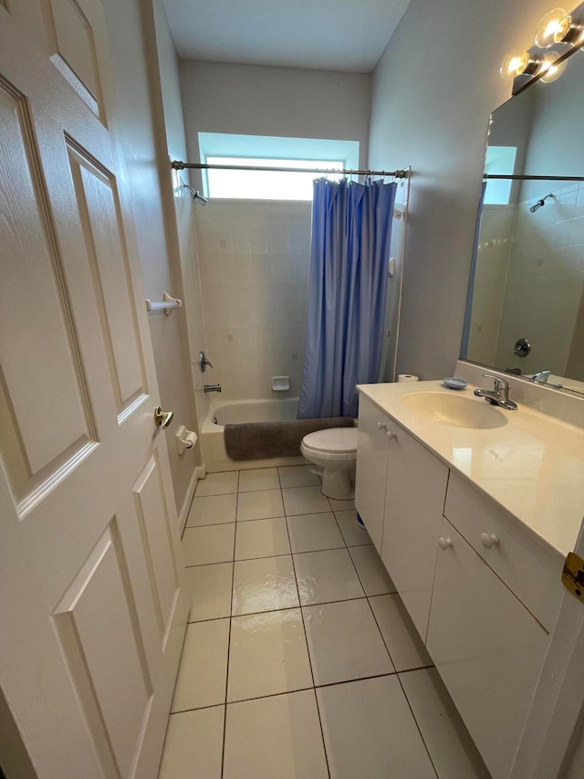 full bathroom featuring shower / bath combination with curtain, vanity, tile patterned flooring, and toilet