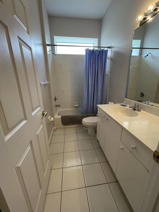 565 SW New Castle Cv, Port Saint Lucie, FL 34986 - full bathroom featuring shower / tub combo with curtain, vanity, and tile patterned floors