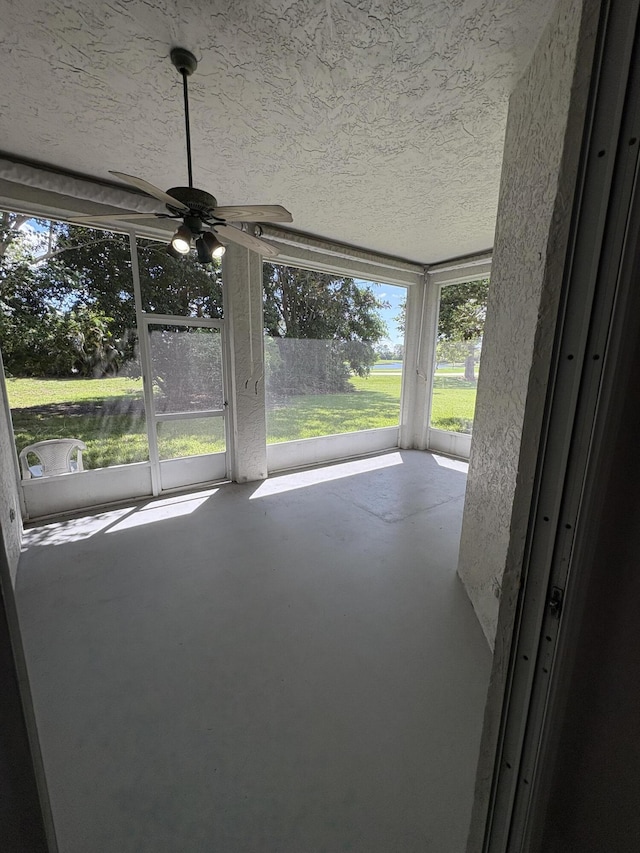 565 SW New Castle Cv, Port Saint Lucie, FL 34986 - unfurnished sunroom featuring ceiling fan