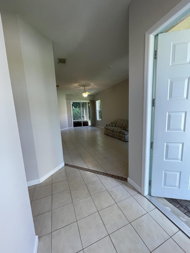 565 SW New Castle Cv, Port Saint Lucie, FL 34986 - foyer with light tile patterned floors and a ceiling fan