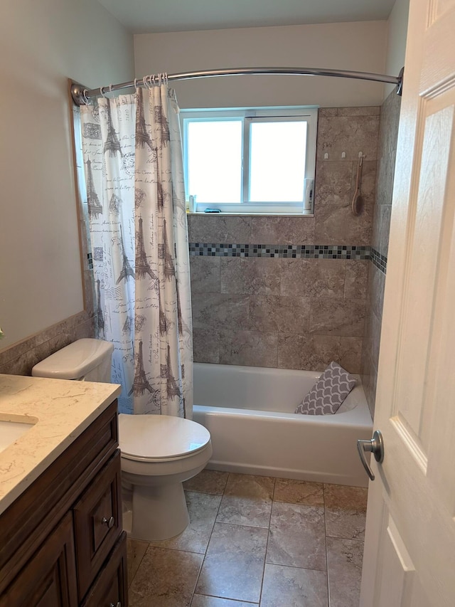 full bathroom with vanity, shower / tub combo, toilet, and tile patterned floors