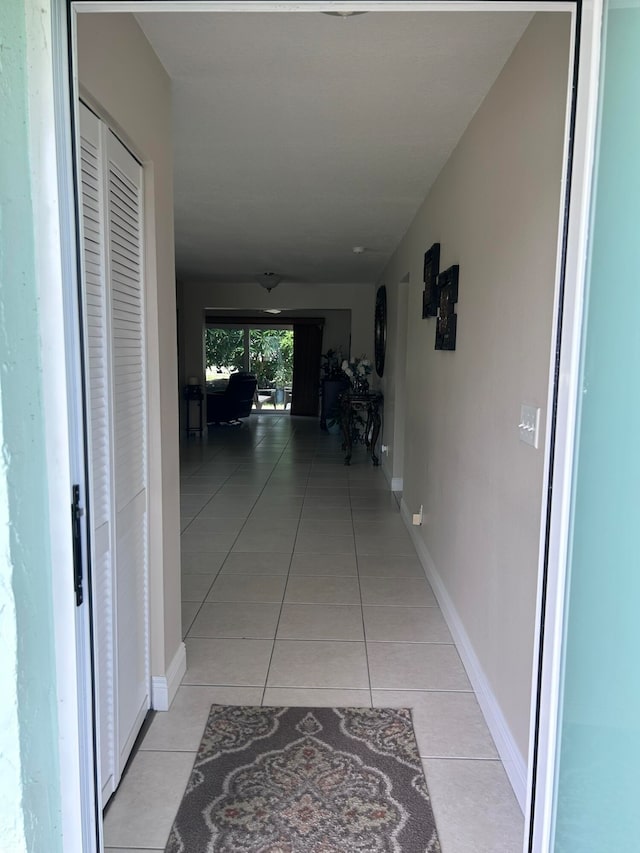 hallway with light tile patterned flooring