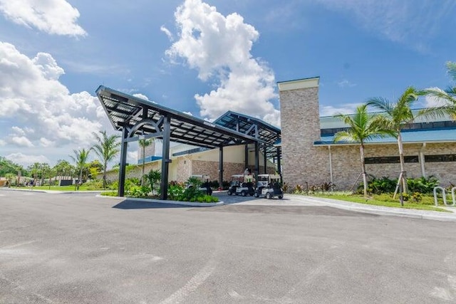 view of vehicle parking featuring a carport