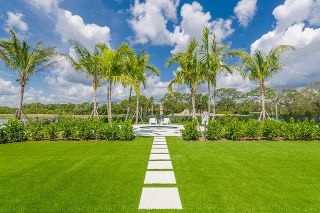 view of home's community featuring a yard and a swimming pool