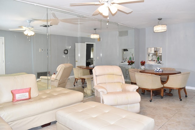 tiled living room with ceiling fan