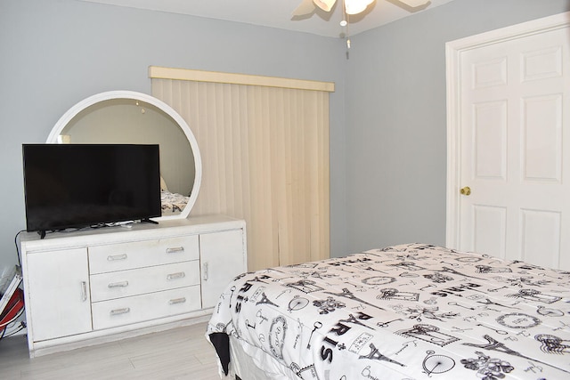 bedroom featuring light wood-type flooring and ceiling fan