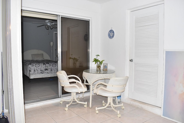 dining space with ceiling fan and light tile patterned floors