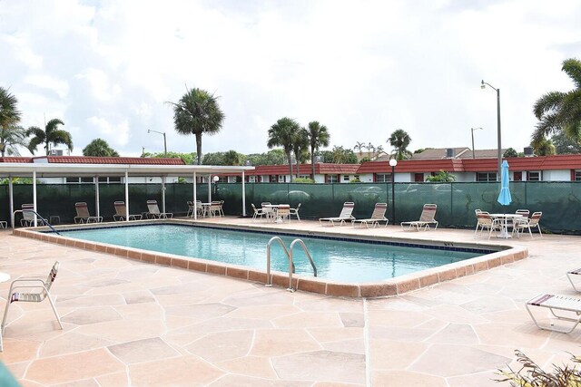 view of pool featuring a patio