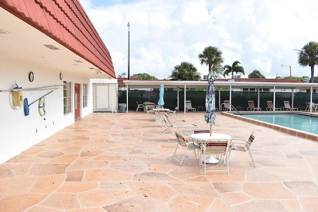 view of patio featuring a community pool