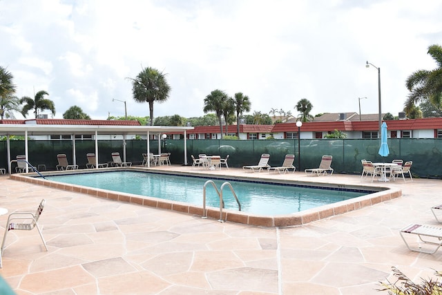 view of swimming pool with a patio area