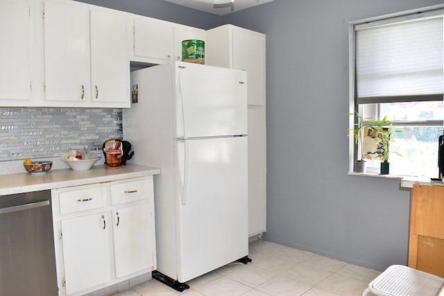 kitchen with white cabinets, dishwasher, backsplash, and white fridge