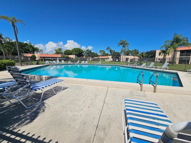 view of pool featuring a patio