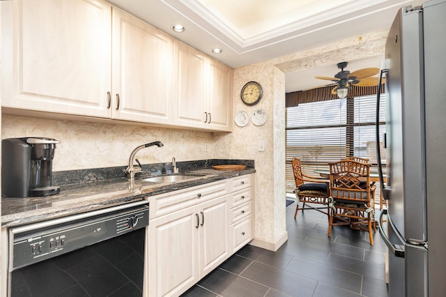 kitchen featuring dark stone countertops, black dishwasher, ceiling fan, and stainless steel fridge