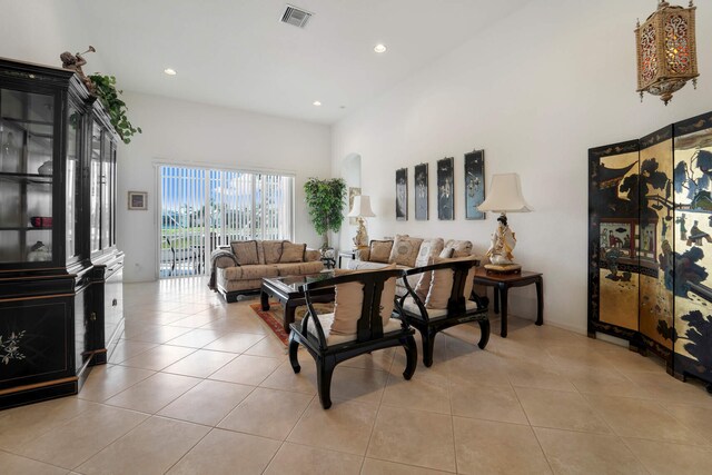 kitchen with sink, appliances with stainless steel finishes, kitchen peninsula, and light tile patterned floors