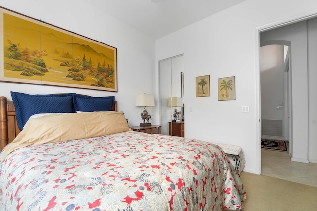 bedroom with carpet and a closet