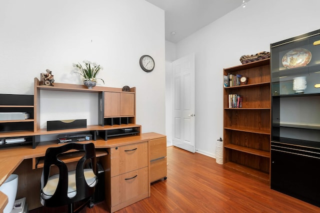 office space with dark hardwood / wood-style flooring