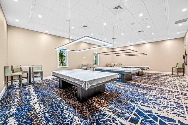 living room featuring crown molding, carpet flooring, and a high ceiling