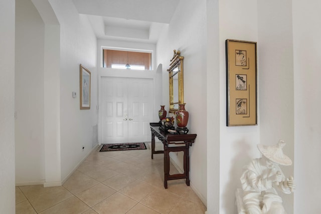 entryway with light tile patterned floors