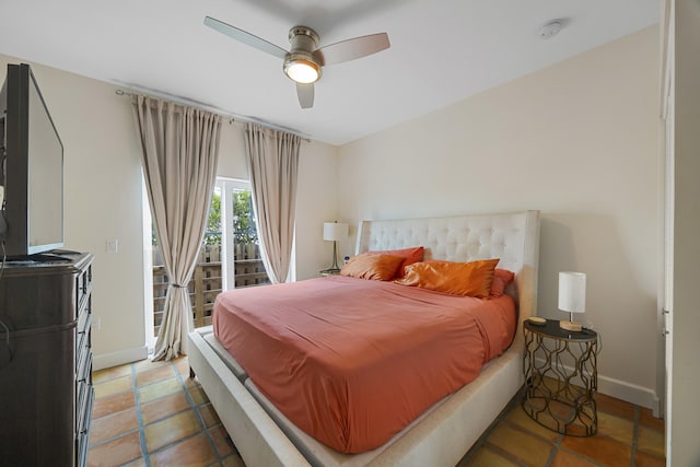 tiled bedroom featuring access to outside and ceiling fan