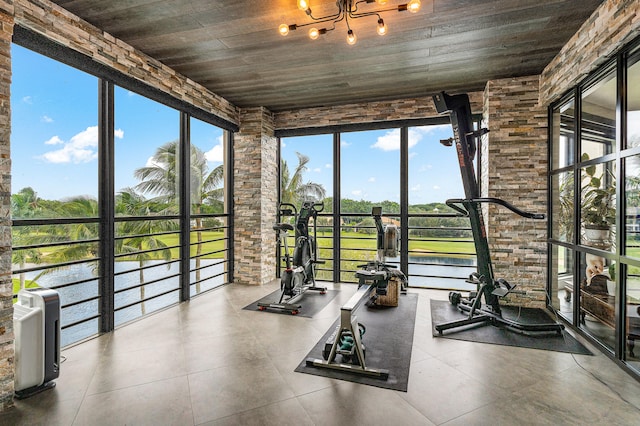 interior space featuring wooden ceiling, a water view, and plenty of natural light