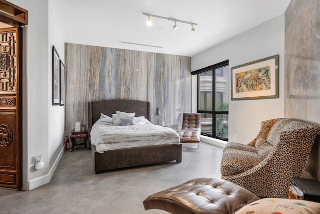 bedroom featuring rail lighting