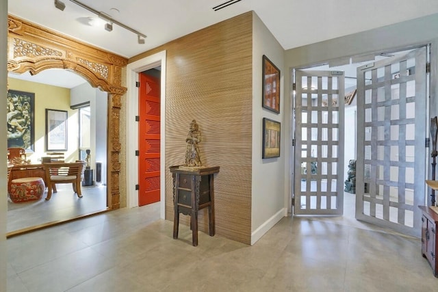 foyer featuring rail lighting