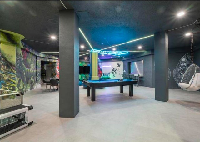 game room with concrete flooring and billiards