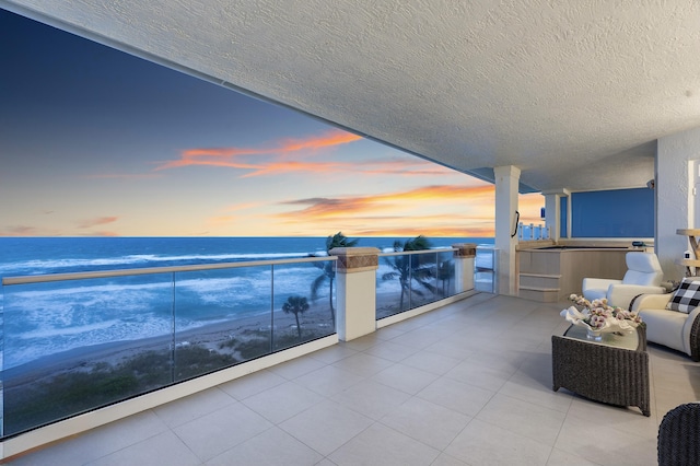 balcony at dusk with a water view