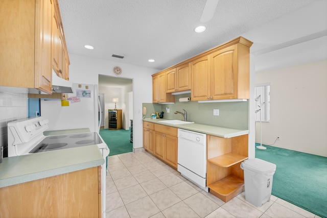 kitchen featuring electric range oven, dishwasher, light carpet, and sink