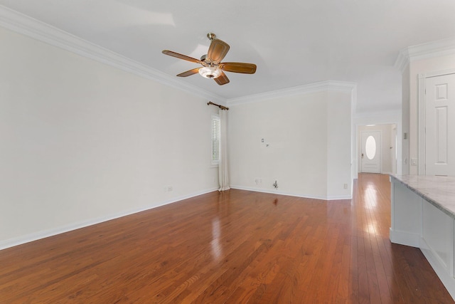 spare room featuring ornamental molding, ceiling fan, and dark hardwood / wood-style flooring