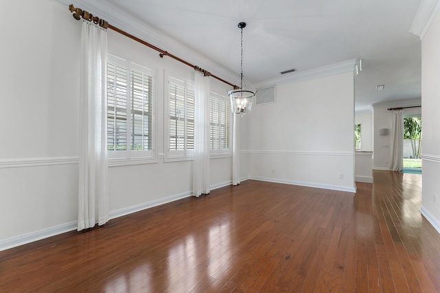 unfurnished dining area featuring an inviting chandelier, dark wood-type flooring, and ornamental molding