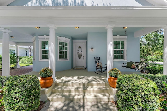 doorway to property with a porch