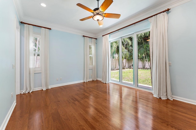 spare room with wood-type flooring, ornamental molding, and ceiling fan