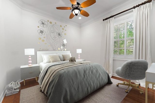 bedroom featuring ceiling fan, crown molding, and hardwood / wood-style floors