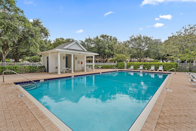 view of swimming pool featuring a patio